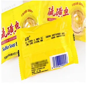 Detail shot of yellow sulfur soap packaging showing ingredients and brand text clearly.