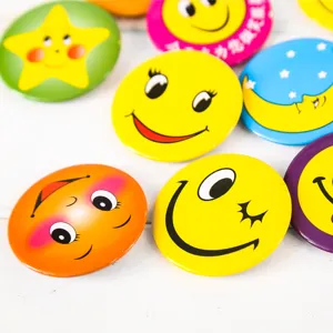 Colorful tinplate badges set featuring cute cartoon smiley faces, stars and moons for backpacks.