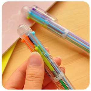 Vista detallada de un bolígrafo retráctil multicolor con tubos de tinta neón para escritura.