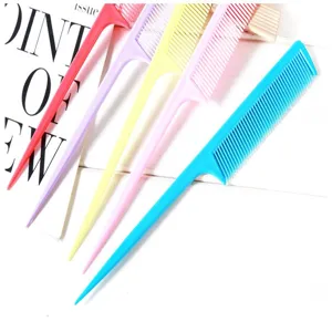 Detail view of colorful tail combs with fine teeth, perfect for hair styling and sectioning.