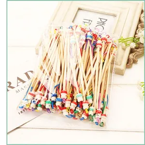 Natural bamboo ear picks with cute doll heads, bagged bulk set for daily ear cleaning use.