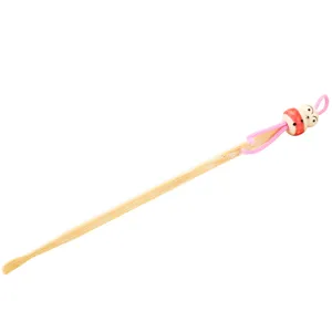 Natural handmade bamboo ear pick with cute doll bead and pink string for daily use.