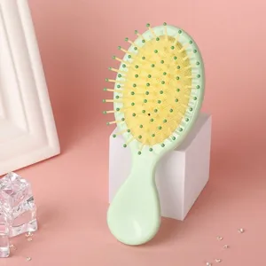 Cute macaron color massage air cushion comb, portable makeup airbag comb detail view.