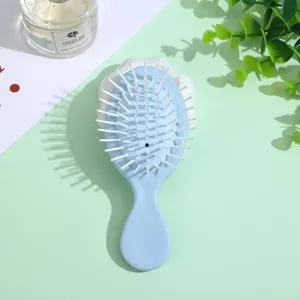 Portable mini macaron blue hair massage comb, cute airbag cushion hairbrush for daily styling.