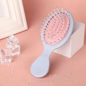 Portable macaron color hair brush with massage air cushion, cute styling tool for daily use.