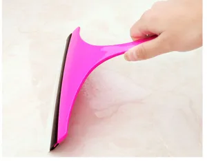 Pink glass window squeegee scraper cleaning tool for home bathroom and floor cleaning.