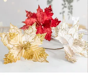 Close-up of sequin velvet Christmas poinsettia flowers for festive tree decoration