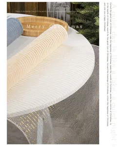 Close-up of sparkling gold decorative PP mesh ribbon for Christmas tree decor