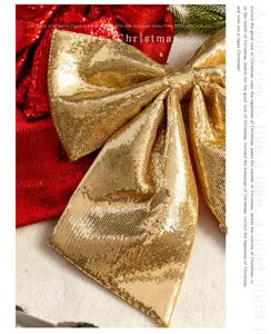 Close-up of large gold sequin Christmas bow decoration with sparkling festive texture