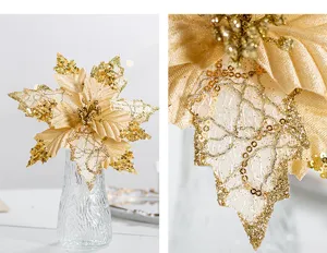 Close-up detail showing intricate gold sequins and fabric texture on Christmas poinsettia