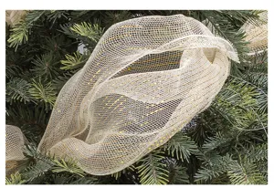 Detail view of gold and silver glitter mesh ribbon on a lush green Christmas tree
