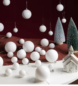 Assorted white Christmas ball ornaments in glossy and matte finishes for festive tree decor
