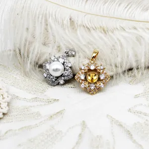 Detailed view of 18K gold plated clover pendant mounts for DIY jewelry making.