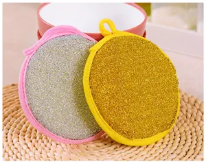 Round double-sided dishwashing sponge scouring pad with hanging loop for kitchen cleaning.