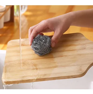 Stainless steel wire mesh cleaning ball for kitchen pots, pans, and dish scrubbing usage.