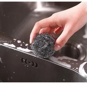 Stainless steel dish washing scrubber detail close up for kitchen sink cleaning tool