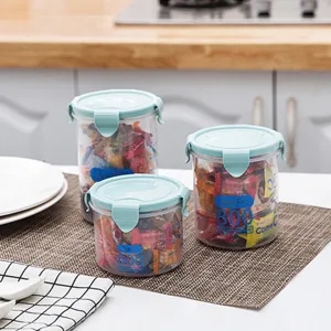 Plastic sealed food storage jars with lids, transparent kitchen containers for snacks and grains.