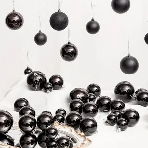 Set of black Christmas ball ornaments in glossy and matte finishes for festive holiday decor.
