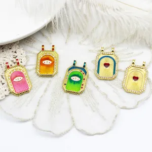 Group of vintage 18K gold plated tarot card pendants with evil eye and heart motifs