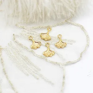 Detailed view of four golden ginkgo leaf charms for DIY necklaces and earring accessories