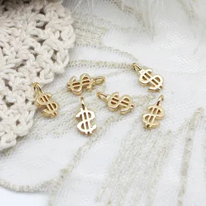 Detailed close-up view of mini gold dollar sign charms for jewelry making and DIY crafts