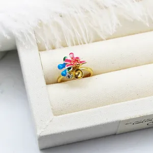 Macro view of gold-plated enamel flower ring setting with pearl mounting and CZ stone