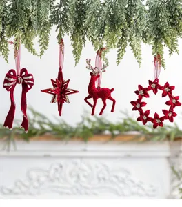 Collection of four elegant burgundy flocked Christmas ornaments featuring gold glitter accents