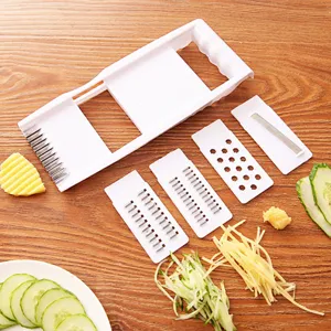 Affettatrice per verdure da cucina multifunzionale con lame intercambiabili per tagliare.
