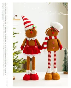 Pair of standing gingerbread man plush dolls with festive red and white winter outfits