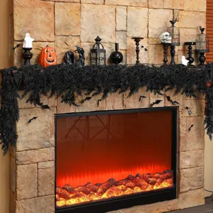 Atmospheric black cedar garland draped over a rustic stone fireplace for Halloween