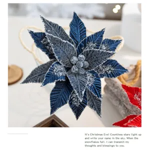Detailed view of blue velvet artificial Christmas flower with silver glitter accents