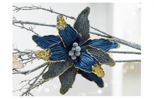 Detailed macro of a dark blue and black Christmas poinsettia with gold glitter
