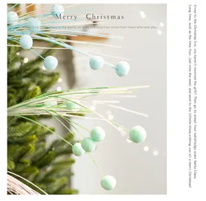 Macro view of glittering Christmas decorative picks with colorful foam pom-poms