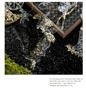 Close-up of transparent acrylic Christmas ornaments with gold sequins in a festive scene.