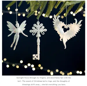 Pearlescent white fairy, key and wings Christmas tree ornaments set with warm lights
