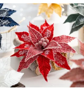 Close-up of a red velvet Christmas poinsettia with sparkling ice crystal details.