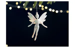Detailed view of iridescent white fairy ornament hanging with bokeh light background