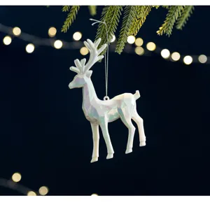 Detailed shot of an iridescent white reindeer Christmas tree ornament with a pearly finish