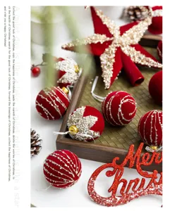 Close-up of burgundy flocked Christmas ball ornaments with glitter details on a tray