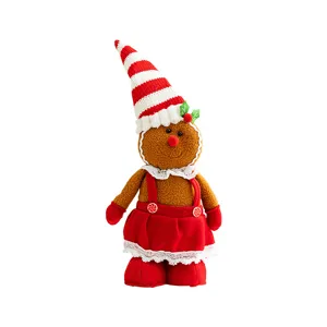 Cute gingerbread girl plush doll with red striped hat for festive Christmas decor