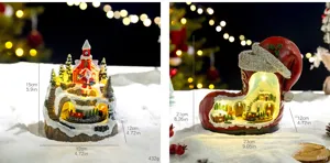 Detailed macro view of two lighted Christmas resin snow house decorations with size and weight specs