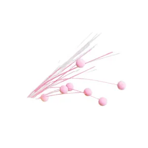 Pink and white Christmas firework willow sticks with soft pom-poms for DIY decor