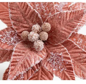 Detailed macro view of pink velvet Christmas flower decorated with icy crystal beads