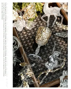 Close-up of elegant transparent acrylic Christmas ornaments decorated with sparkling gold sequins