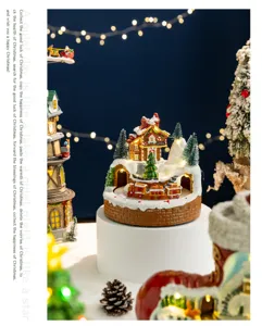 Detailed view of a glowing Christmas snow house music box with a rotating train.