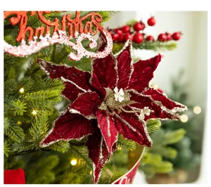 Detailed view of a wine red flocked Christmas flower ornament with elegant gold glitter edges.