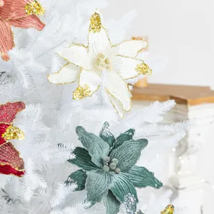 Elegant artificial velvet Christmas flowers decorated with glitter sequins on a white tree