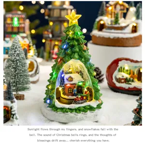 Musical glowing Christmas tree ornament with rotating train and snow house scene