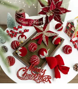 Detail view of wine red flocked Christmas ornaments set including balls stars and bows