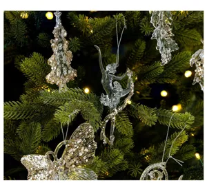 Detailed view of crystal acrylic ballet dancer ornament with gold sequins on Christmas tree